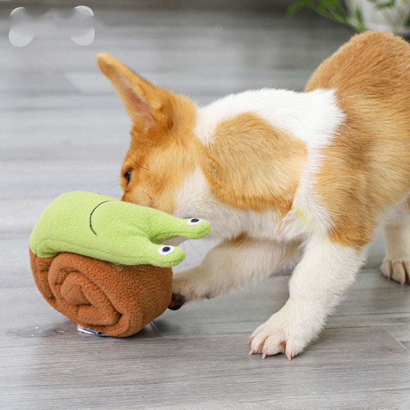 Corgi playing with CanineFun™ Training & Sniff Toy shaped like a snail, featuring hidden pockets and a squeaker for foraging fun.